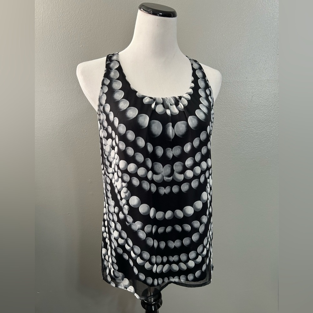 The limited women’s size,S,‎ scoop, neck blouse with pleaded front sleeveless